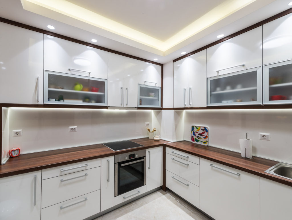 Big white kitchen in a modern apartment